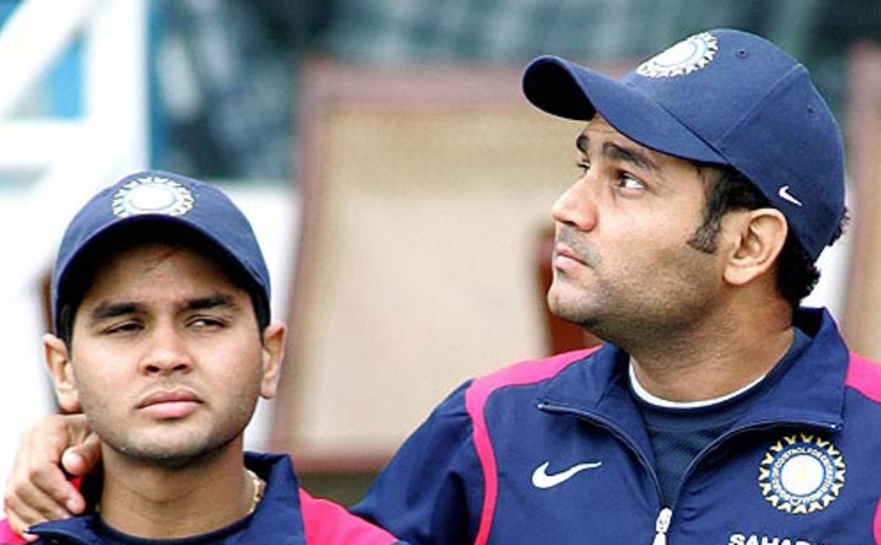 Parthiv Patel and Virender Sehwag ponder the likeliness of play, India in Pakistan, 1st Test, Lahore, January 17, 2006