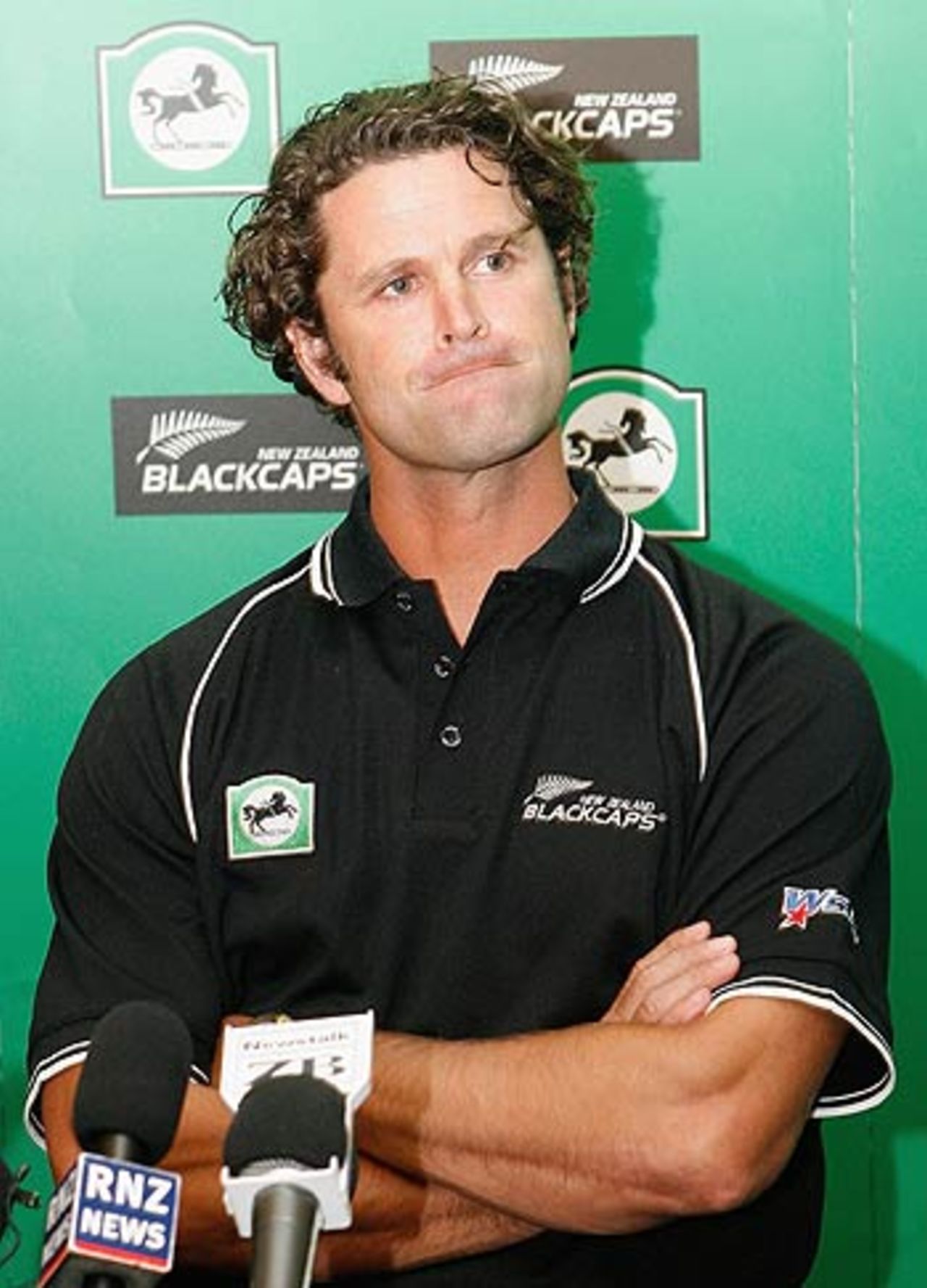 Chris Cairns pauses during the announcement of his retirement from international cricket at a news conference in Christchurch, January 23, 2006