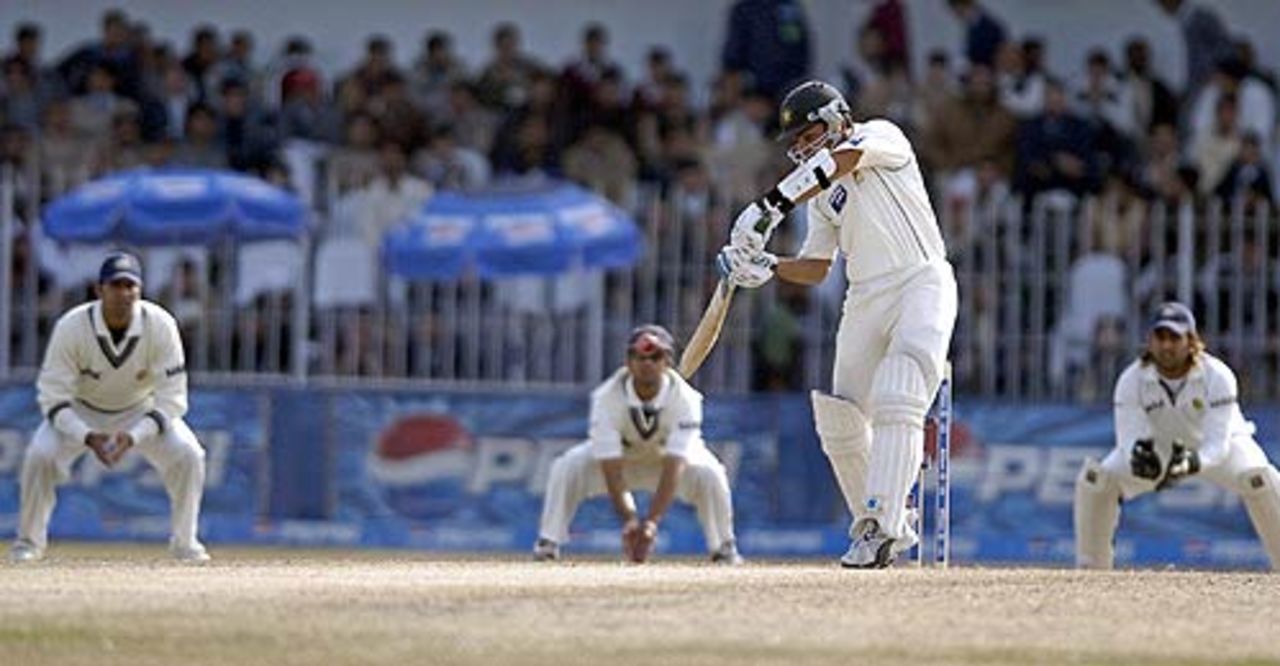 Indian slip fielders wait in anticipation as Kamran Akmal plays a shot, Pakistan v India, 2nd Test, 4th day, Faisalabad, January 24 2006