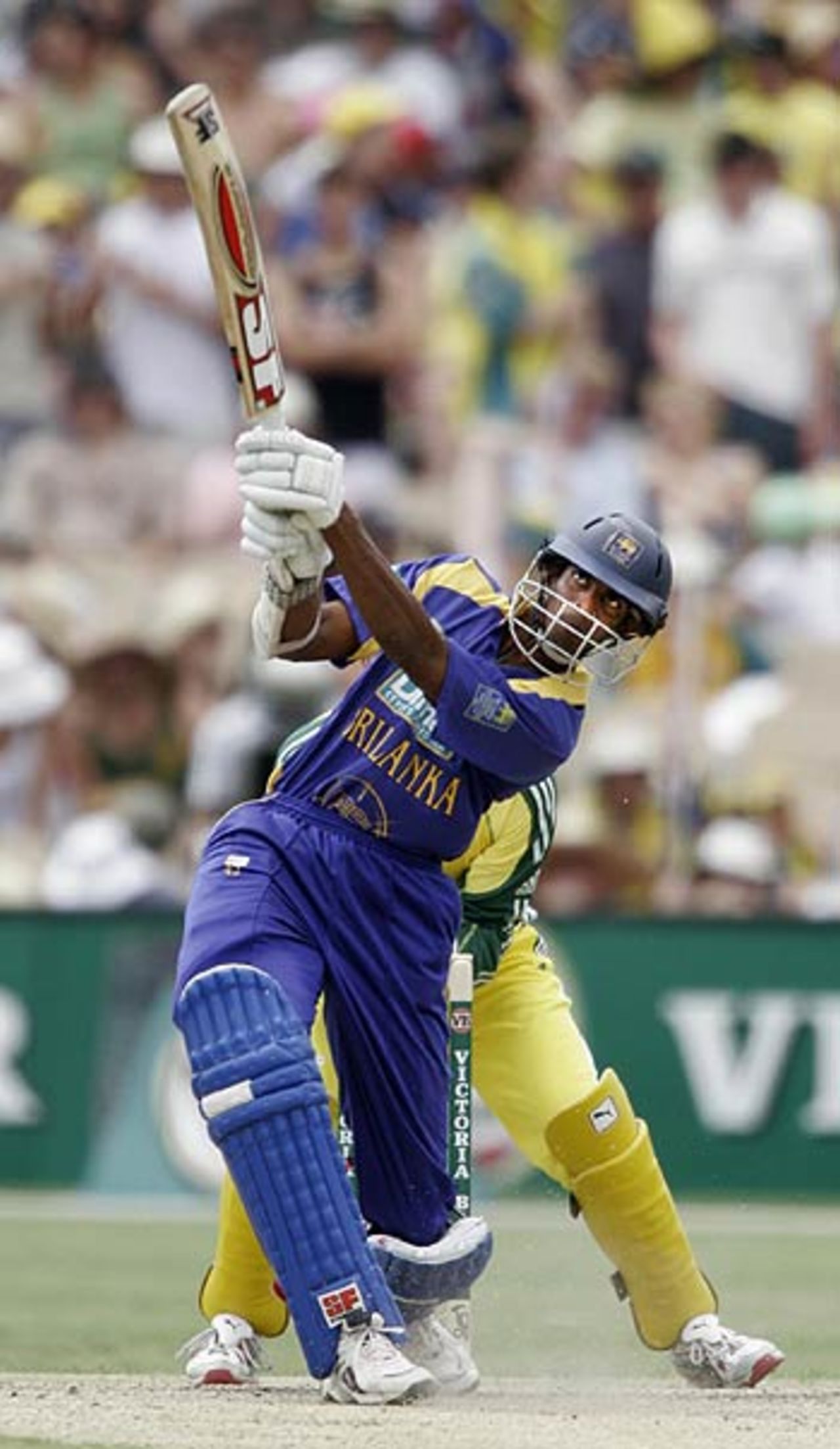 Jehan Mubarak launches Andrew Symonds over the ropes, Australia v Sri Lanka, 7th match, VB Series, Adelaide, January 26, 2006