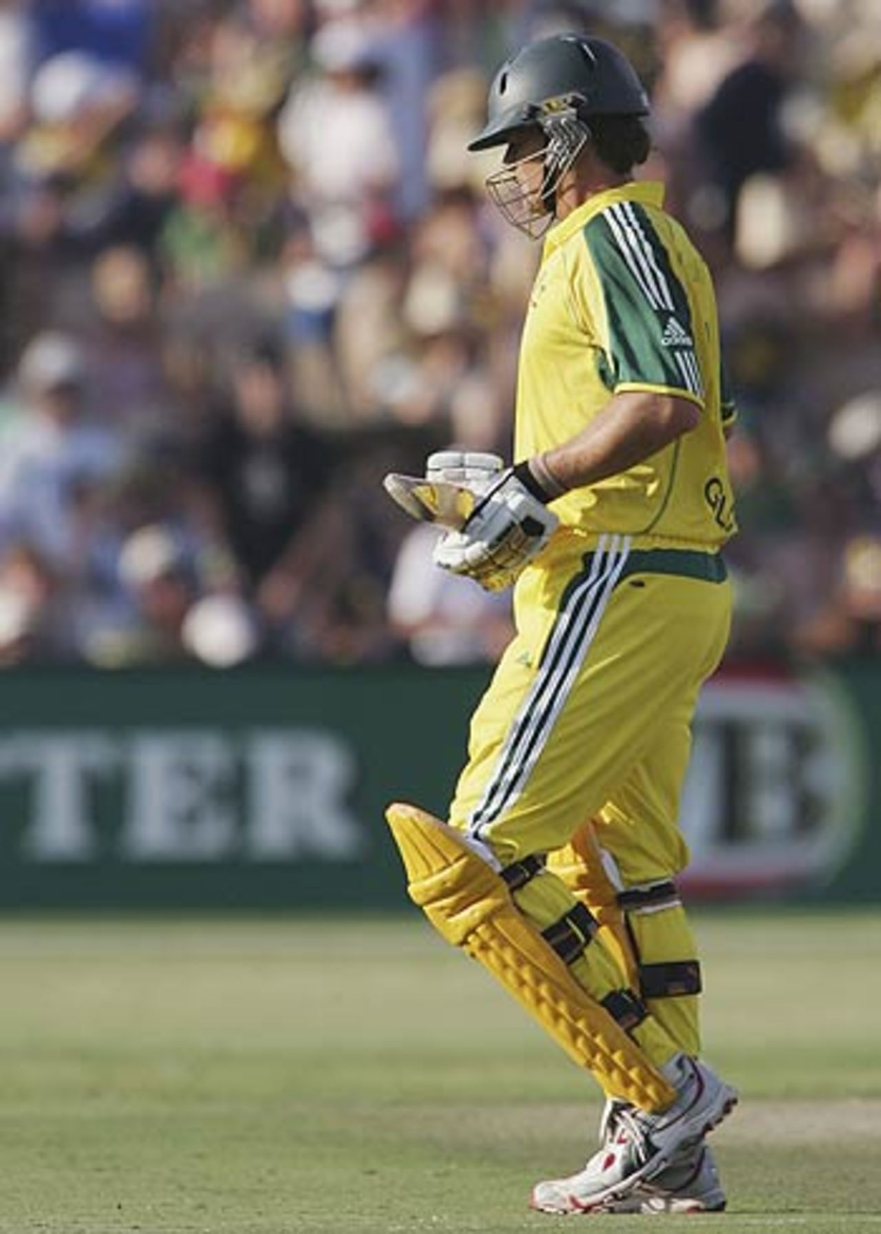 Adam Gilchrist walks back after chipping one to mid-off, Australia v Sri Lanka, 7th match, VB Series, Adelaide, January 26, 2006