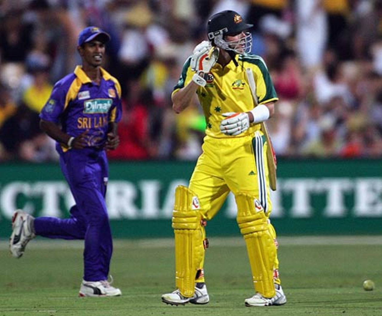 damien-martyn-walks-back-after-being-bowled-by-muttiah-muralitharan