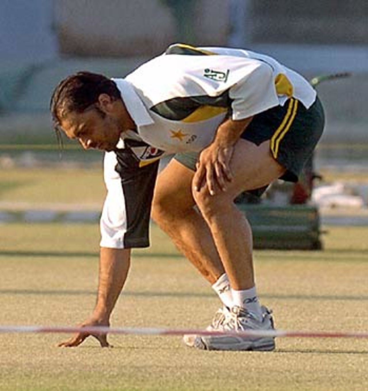 Shoaib Akhtar inspects the pitch, Karachi, January 27, 2006