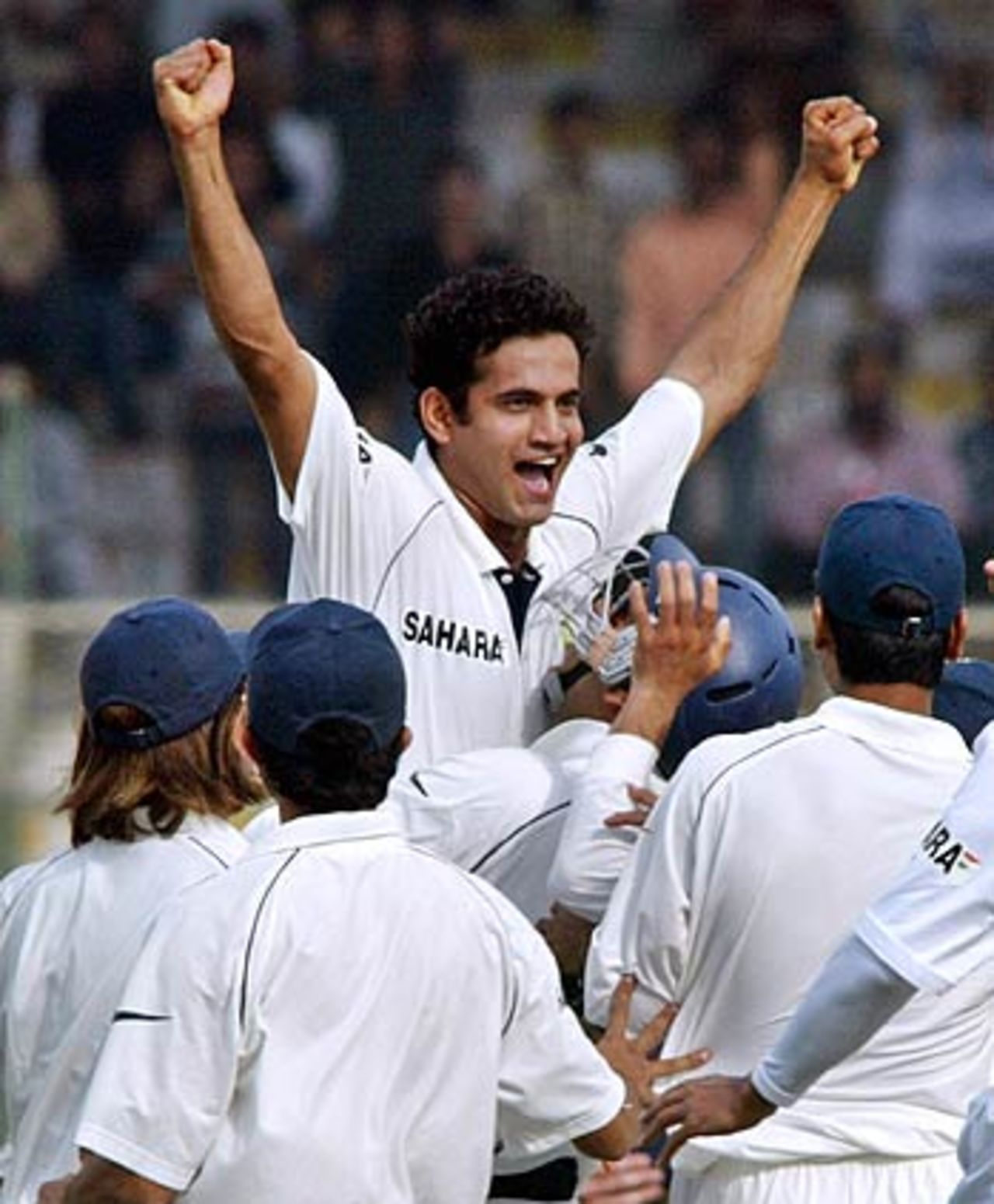 The Indians mob Irfan Pathan after his hat-trick, India v Pakistan, 3rd Test, Karachi, 1st day, January 29, 2006