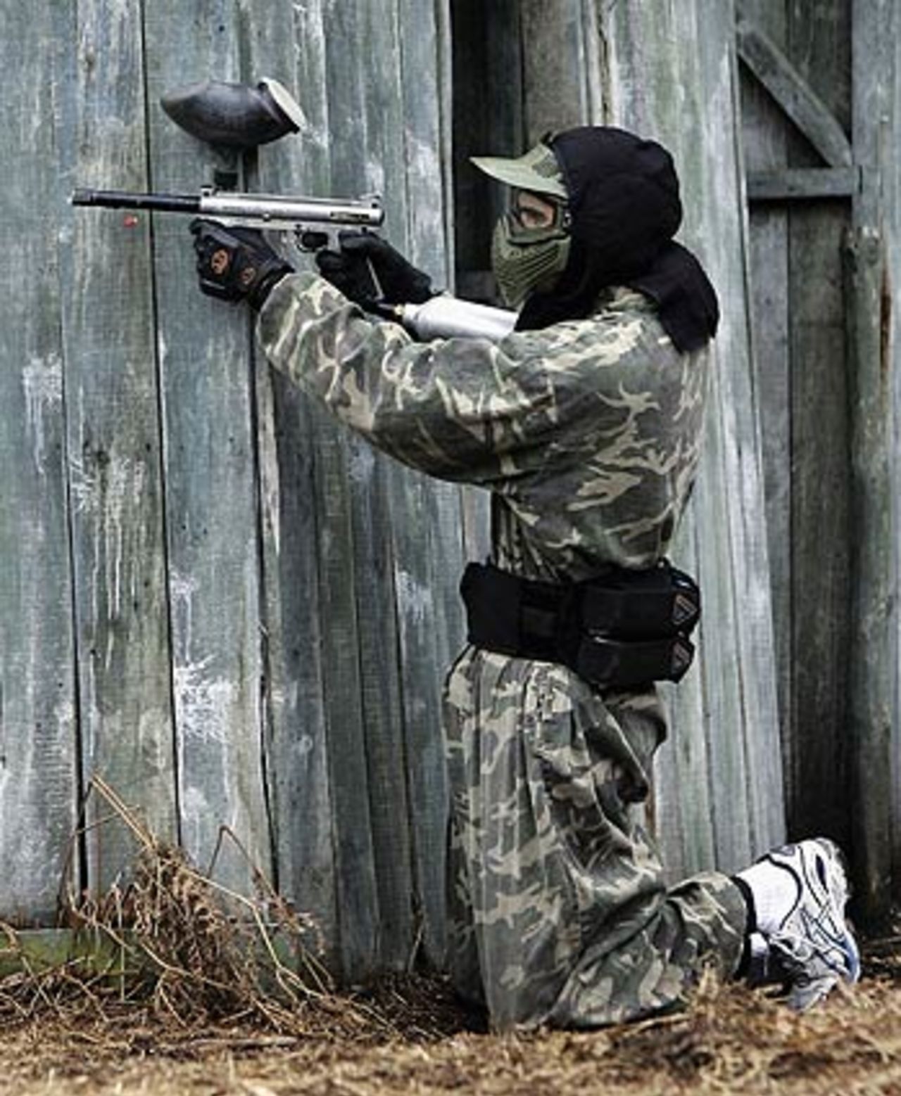 James Anderson takes a potshot during a paintball game at National Paintball Fields in Bassets Pole, Birmingham, January 31, 2006