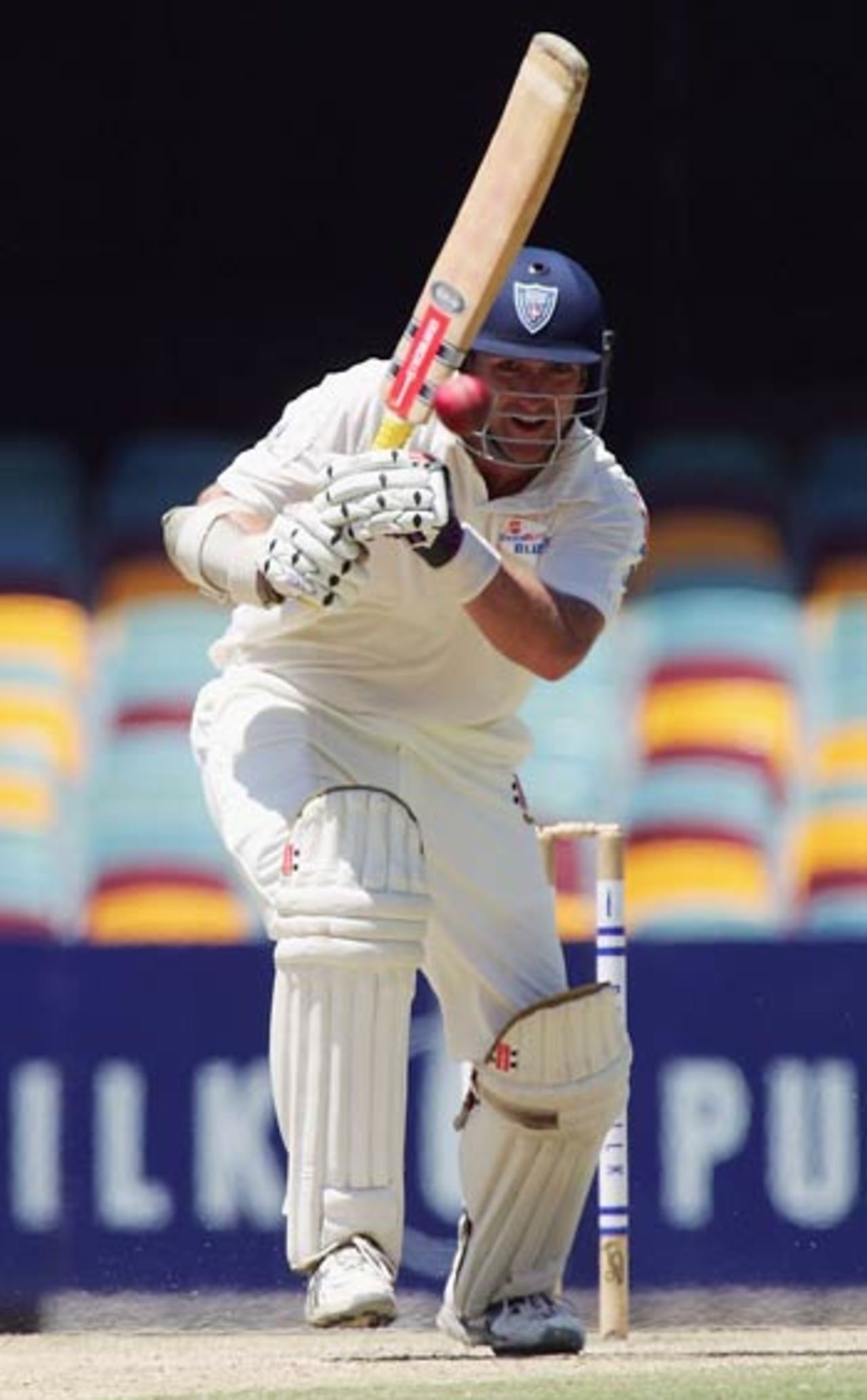 Phil Jaques crunches a drive down the ground on his way to a hundred, Queensland v New South Wales, Brisbane, February 4, 2006