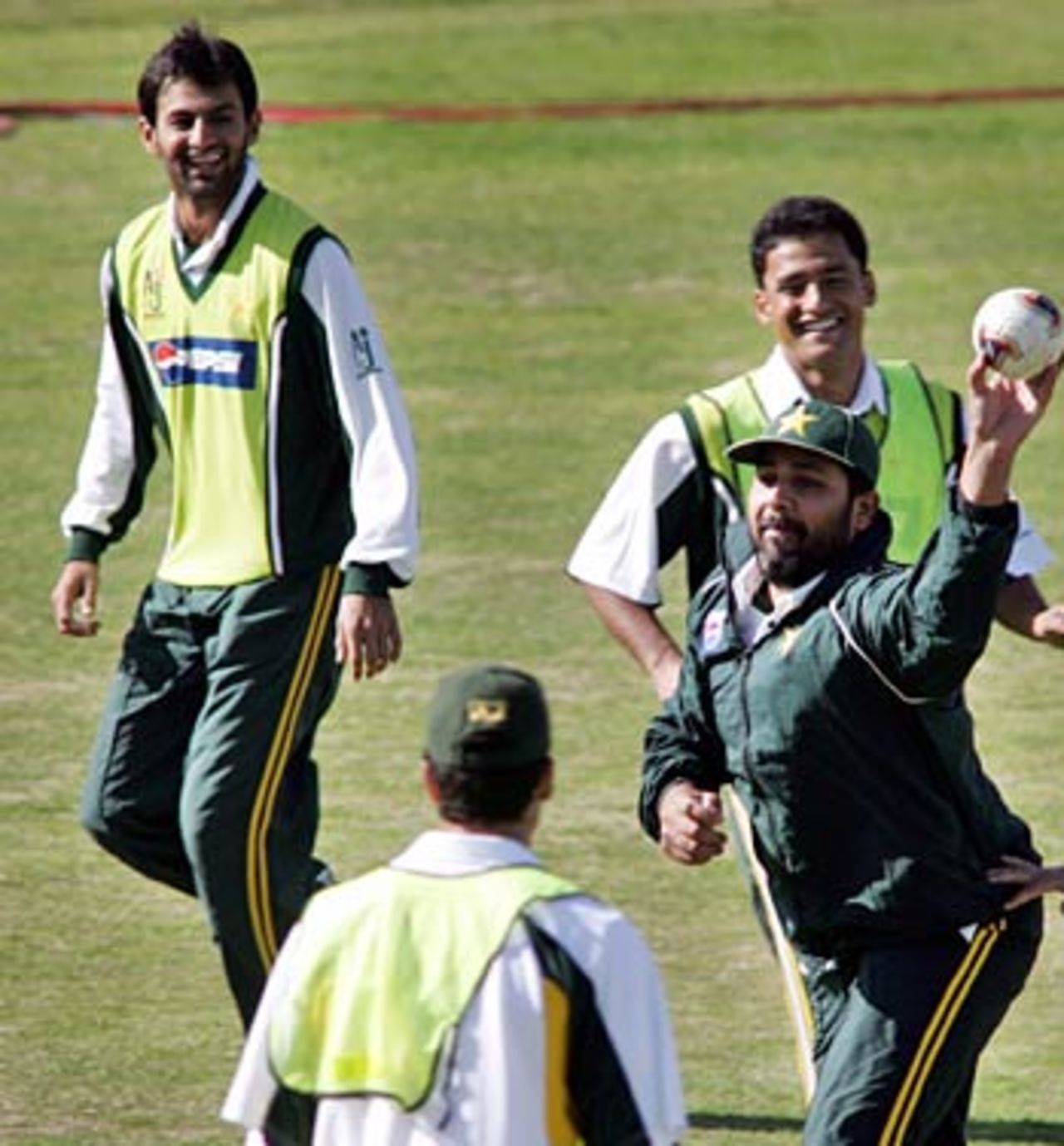 Inzamam-ul-Haq and his teammates play handball during a practice session at The Arbab Niaz stadium , Peshawar, February 4, 2006
