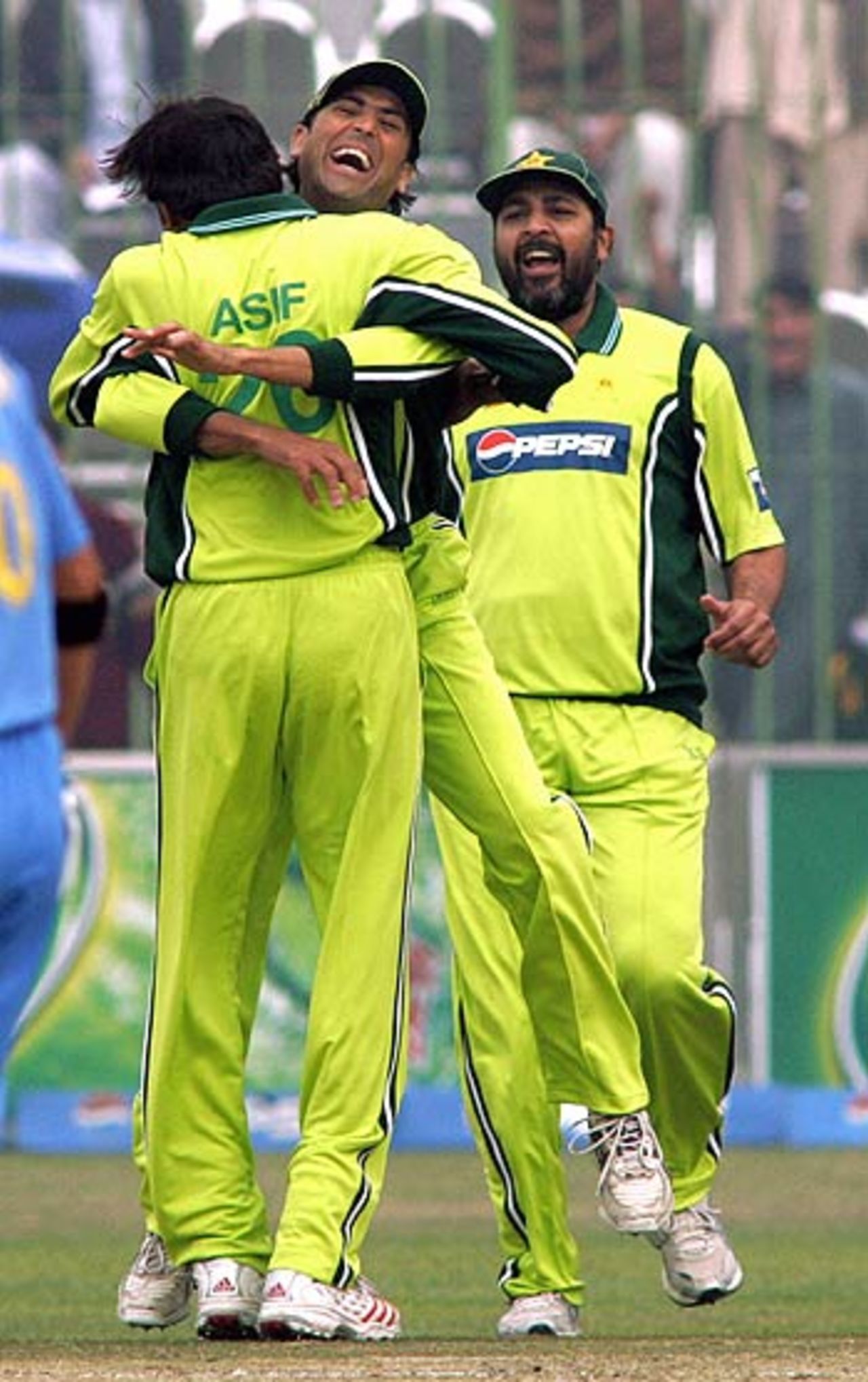 Younis Khan hugs Mohammad Asif after Virender Sehwag falls, Pakistan v India, 1st ODI, Peshawar, February 6, 2006