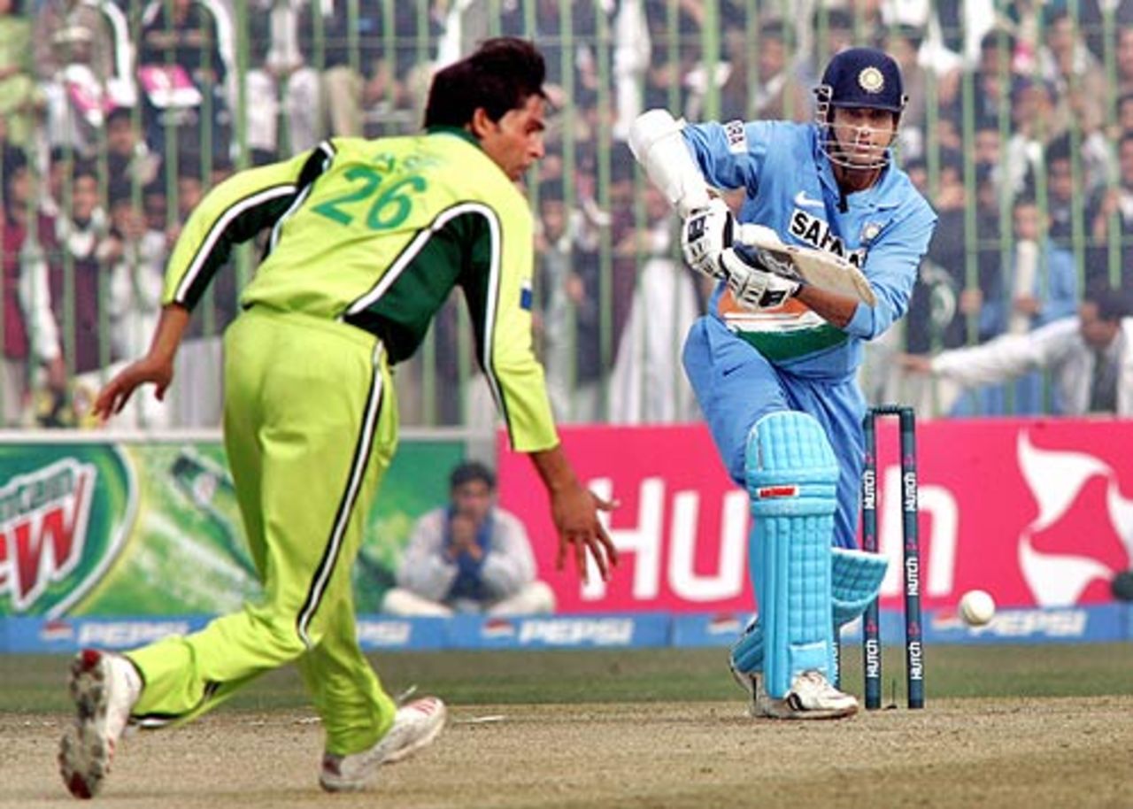 Irfan Pathan drives past Mohammad Asif, Pakistan v India, 1st ODI, Peshawar, February 6, 2006