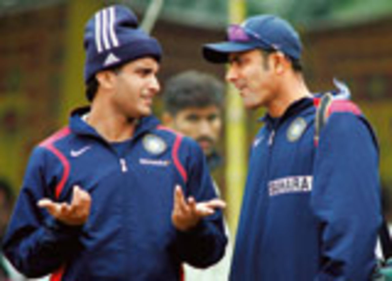 Sourav Ganguly and Anil Kumble talk to each other at a warm-up session on the 2006 tour of Pakistan