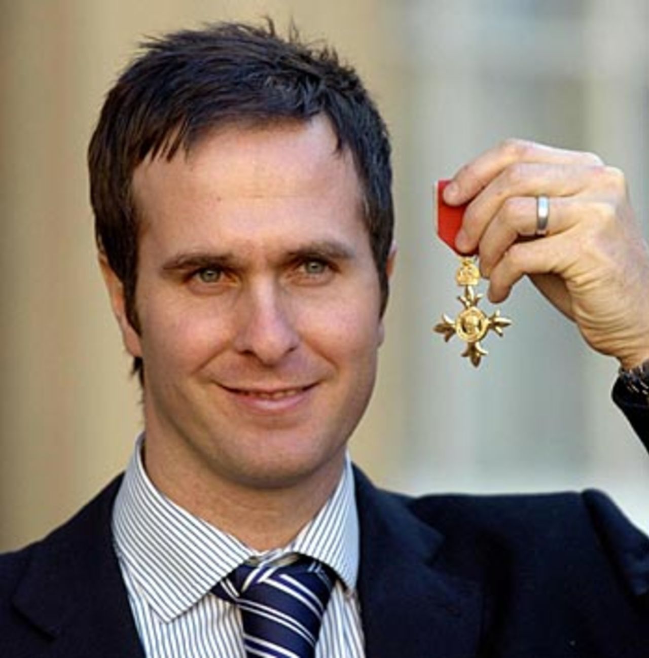 Michael Vaughan poses after receiving his OBE at Buckingham Palace, February 9 2006