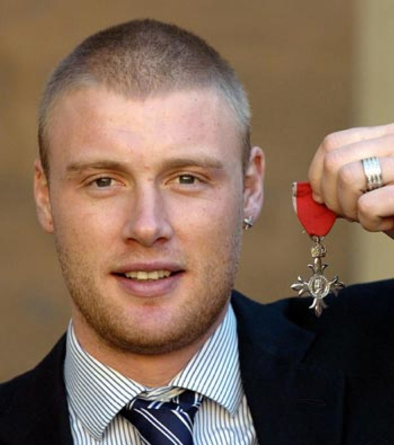 Andrew Flintoff poses after receiving his MBE at Buckingham Palace, February 9 2006