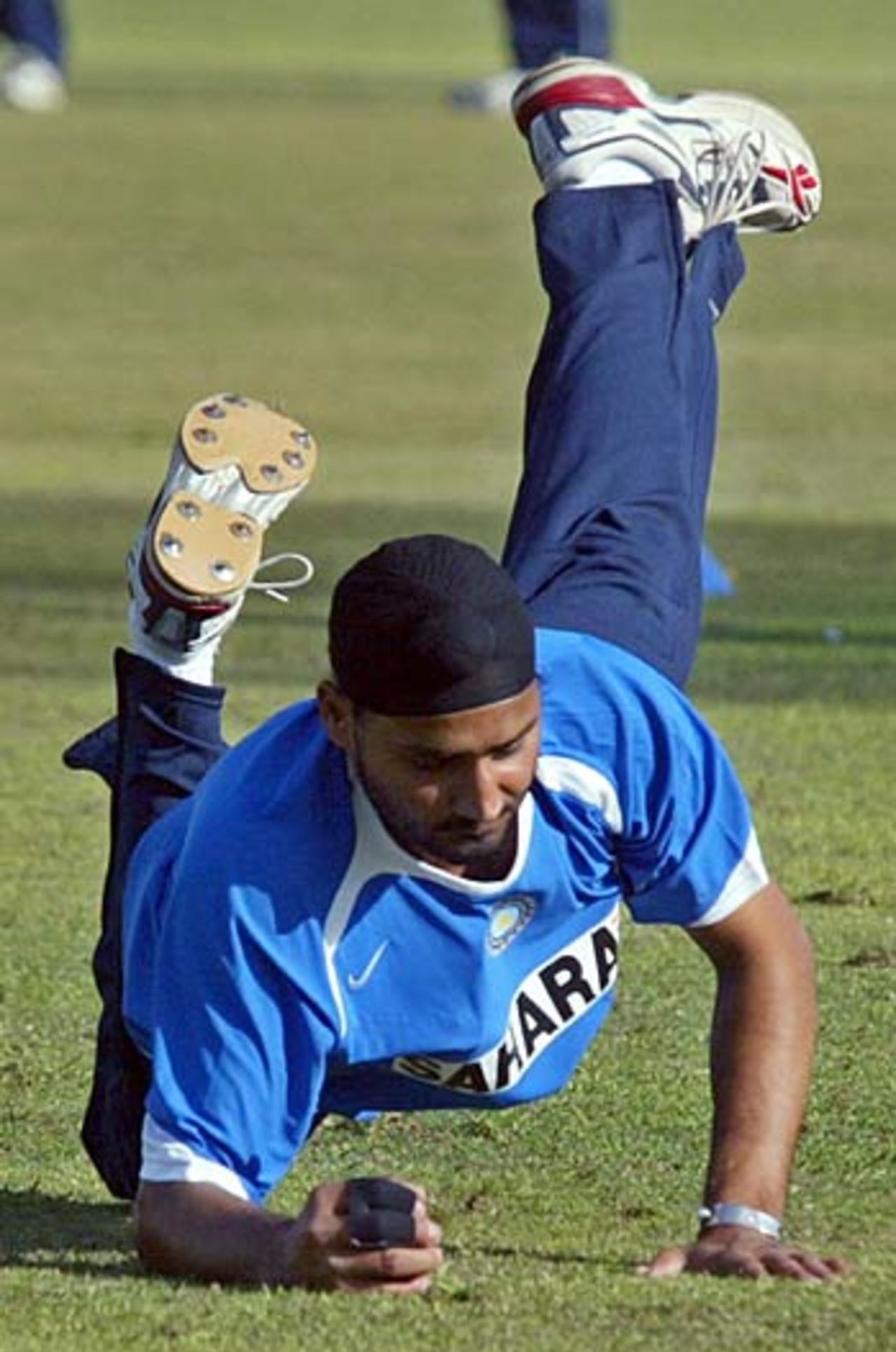Harbhajan Singh dives for the ball during practice, Rawalpindi, February 10, 2006