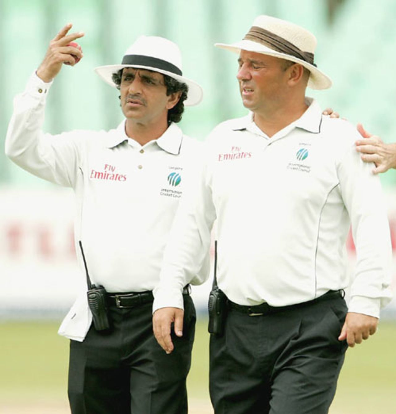 Asad Rauf helps Mark Benson off the field after he complained of heart palpitations, South Africa v India, 2nd Test, Durban, December 28, 2006 
