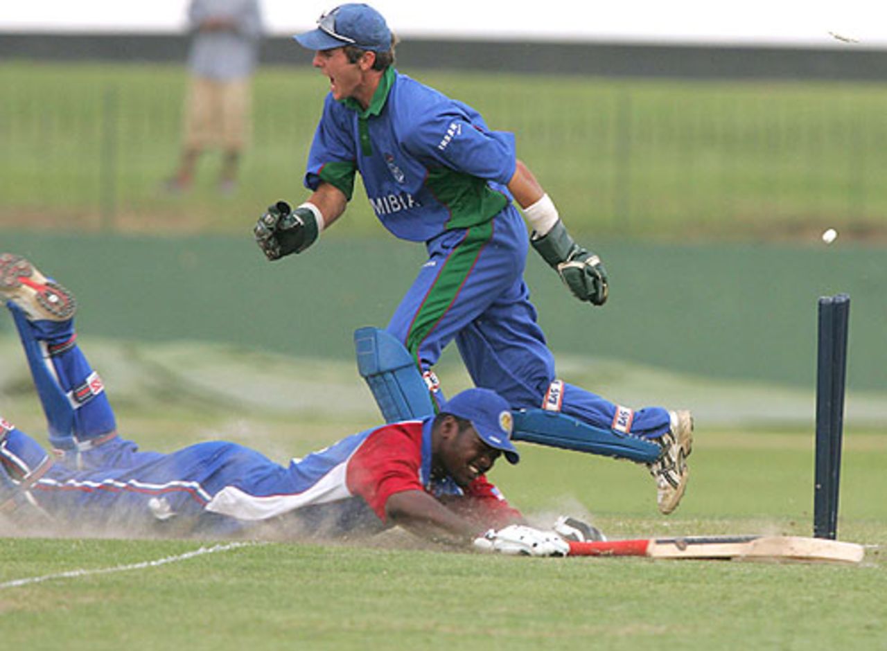 Romeno Deane of the USA is run out as Namibias Ewald Steenkamp celebrates.  The USA eventually won the Plate Championship quarter-final in the ICC U19 Cricket World Cup by two wickets in Colombo on Tuesday, their first-ever win in the tournament. February 14, 2005