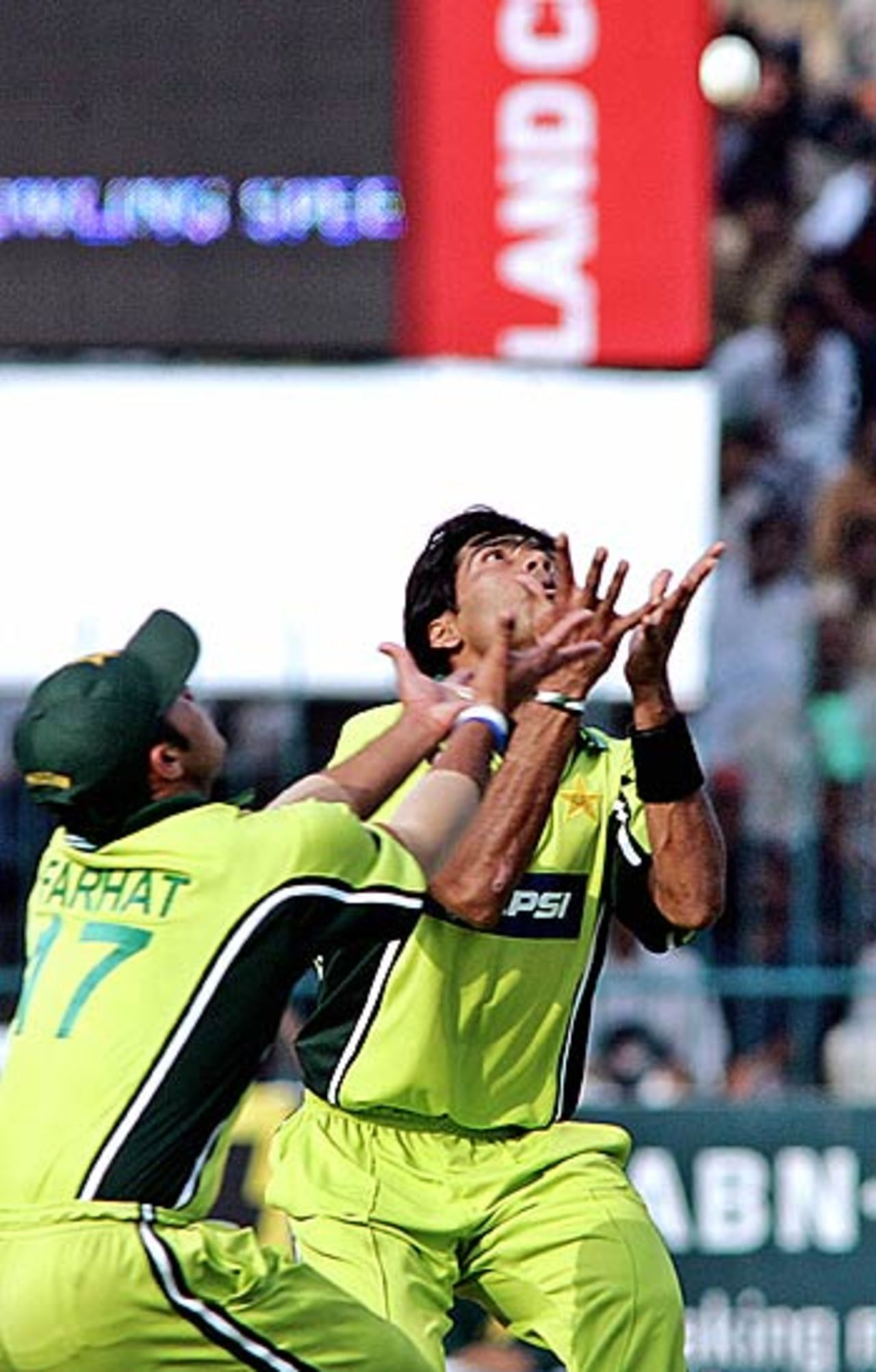 Mohammad Sami just manages to get under the ball with Imran Farhat almost getting in the way, Pakistan v India, 4th ODI, Multan, February 16 2006