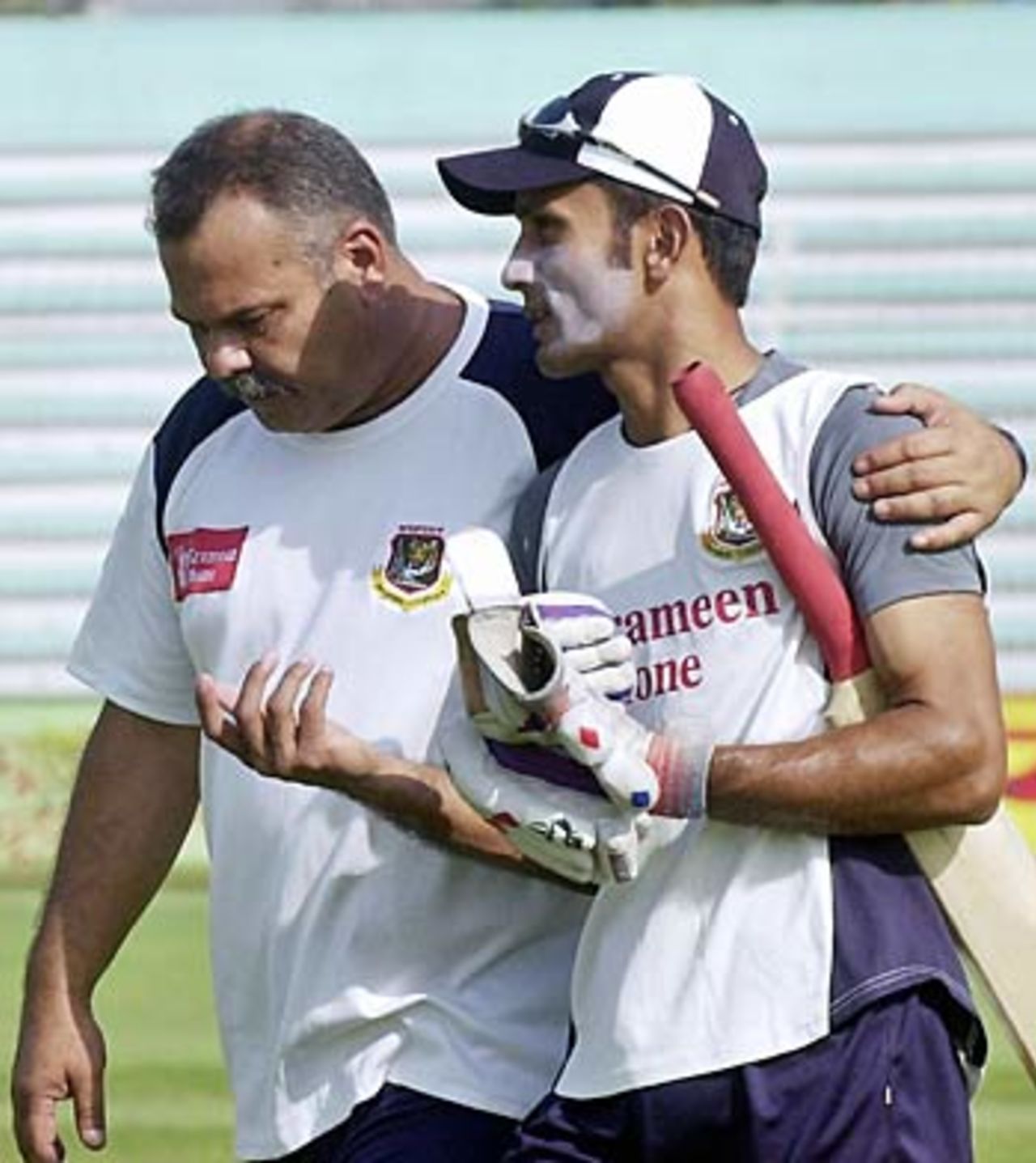 Dav Whatmore chats with Khaled Mashud the nets at Bogra, February 17, 2006