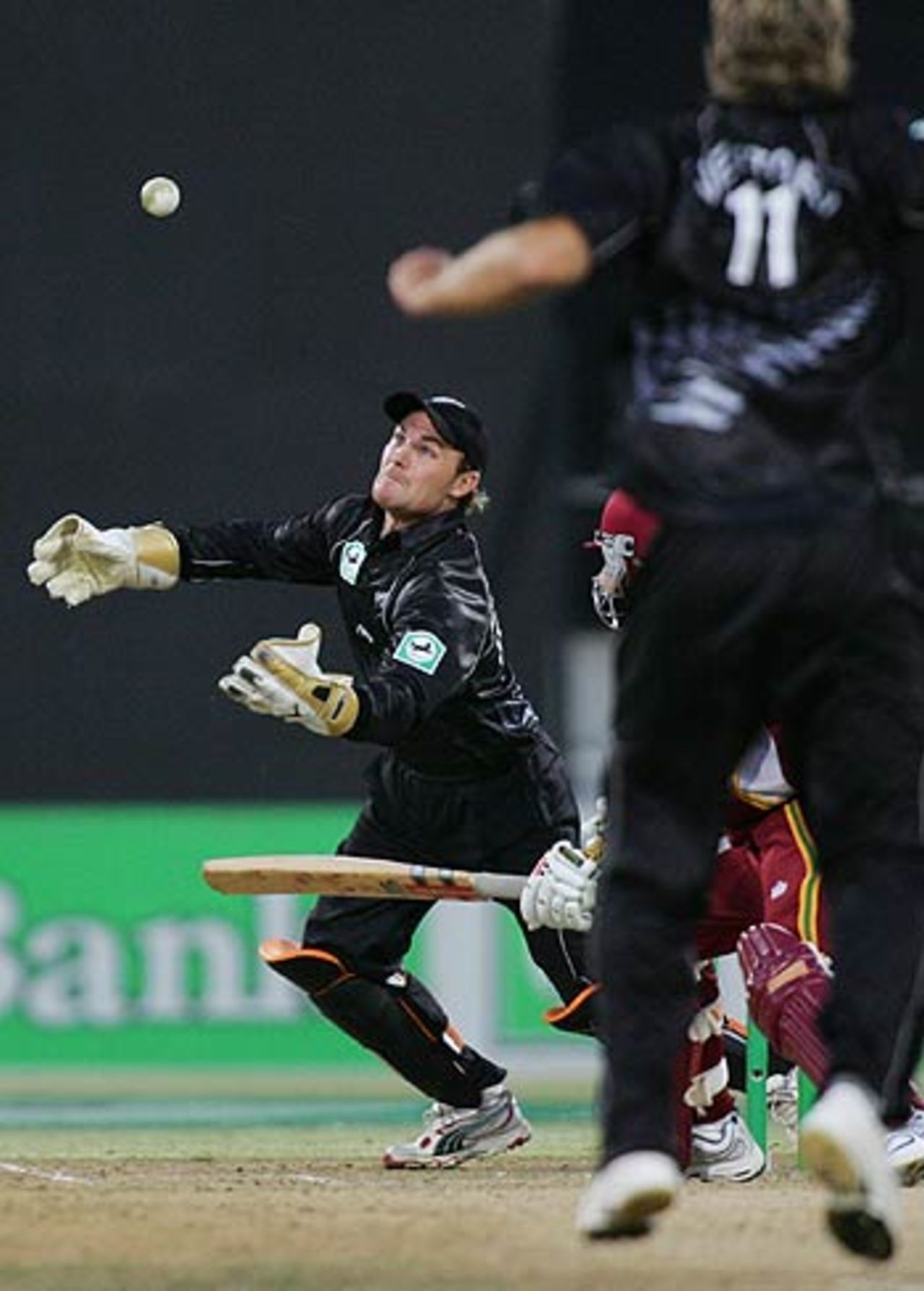 Brendon McCullum attempts to take a catch off Daniel Vettori, New Zealand v West Indies, 1st ODI, Wellington, February 18 2006