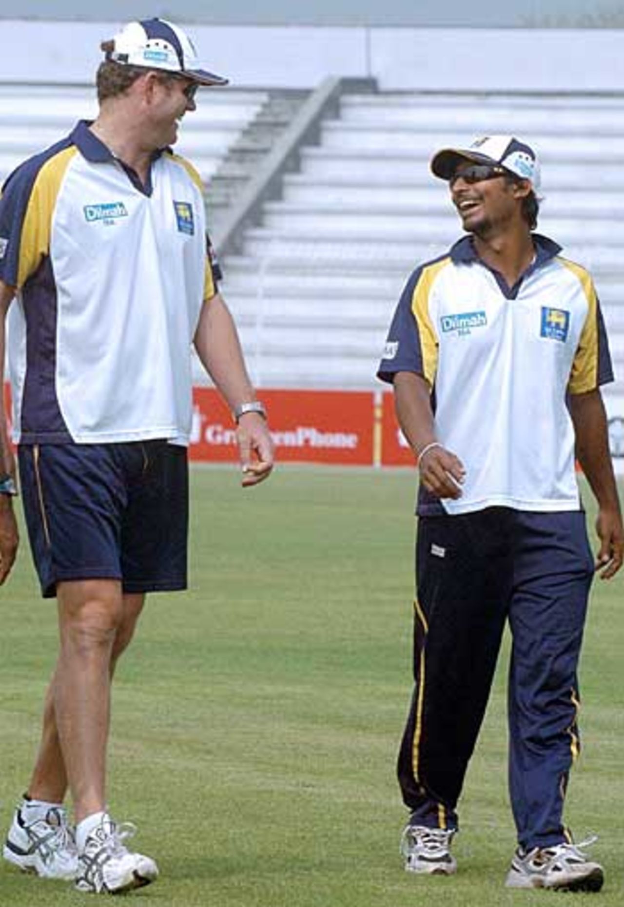 Sri Lanka coach Tom Moody and Kumar Sangakkara share a joke during a practice session, Bogra, February 19, 2006