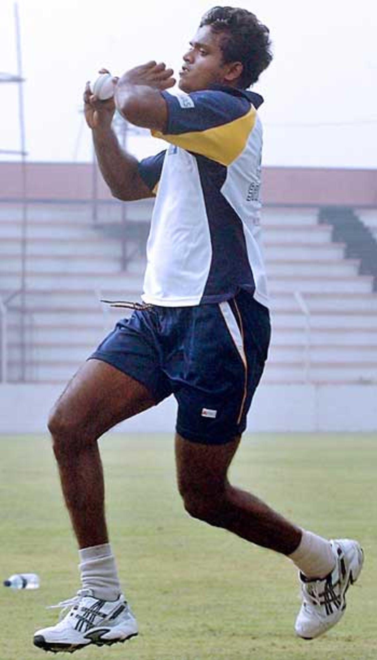 Dilhara Fernando races into bowl in a net session, Bogra, February 19, 2006