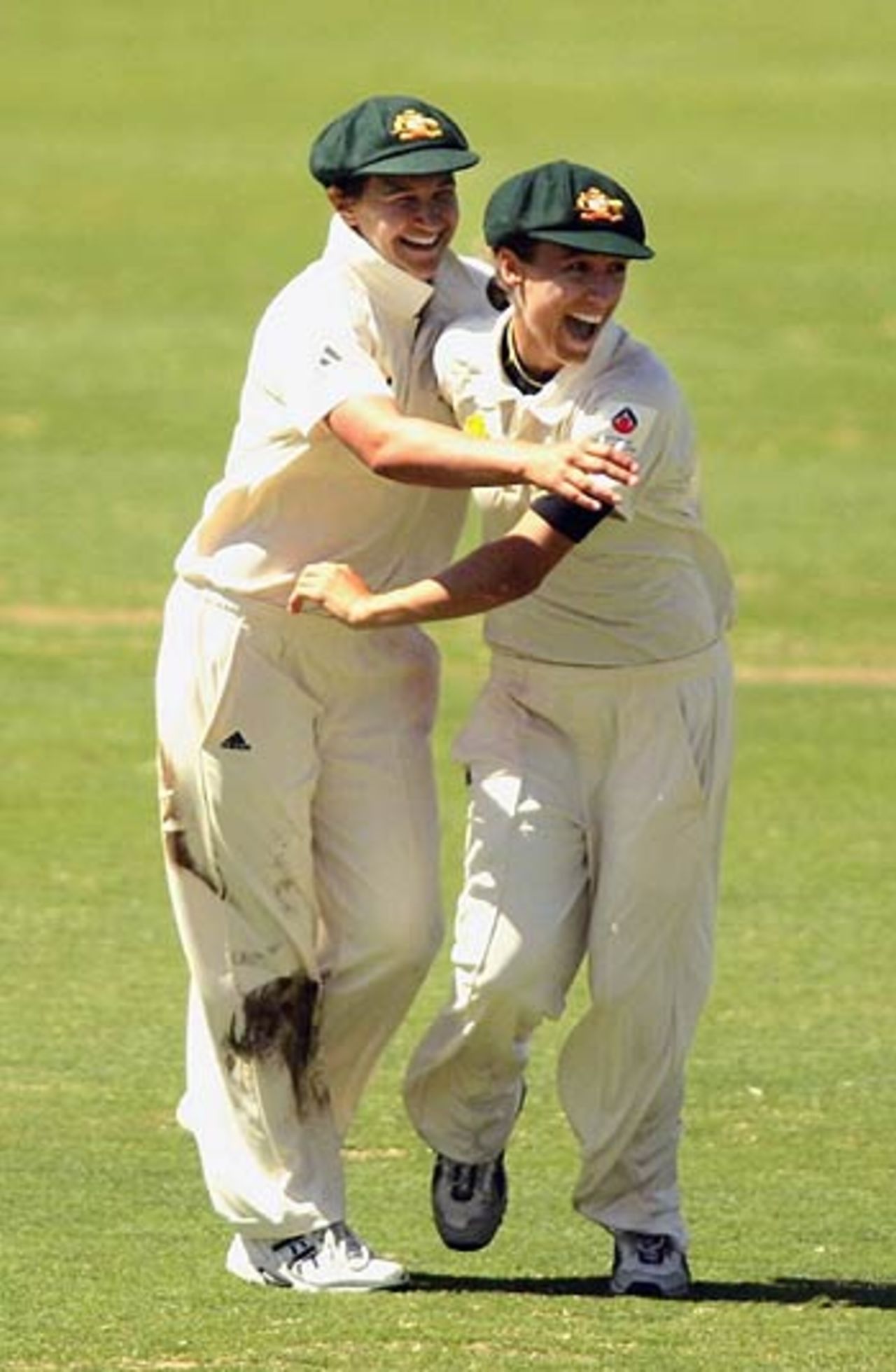 Lisa Sthalekar and Shelley Nitschke celebrate the fall of a wicket, 
Australia Women v India Women, Only Test, Adelaide Oval, February 18 2006