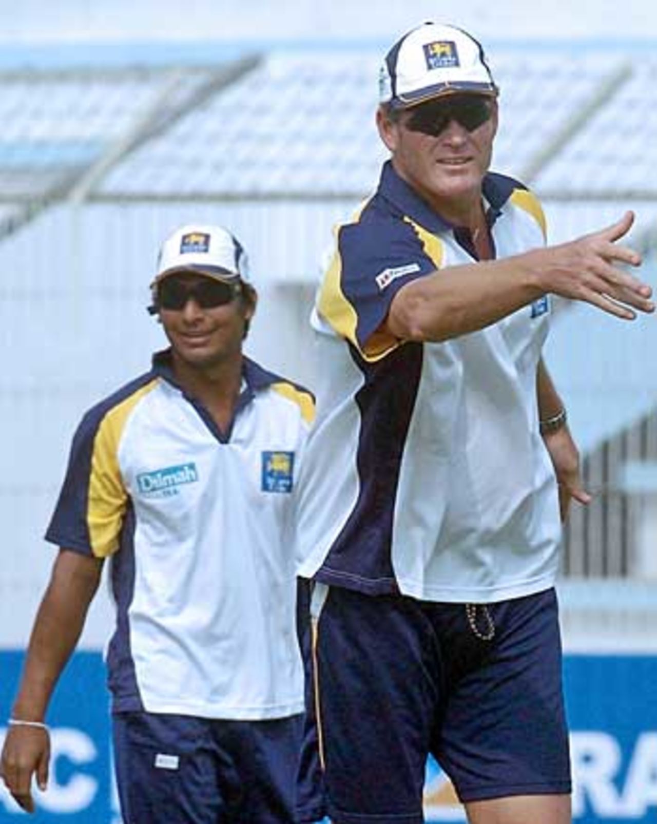 Sri Lanka coach Tom Moody throws a frisbee, watched by Kumar Sangakkara, Sri Lanka in Bangladesh, Bogra, February 21, 2006
