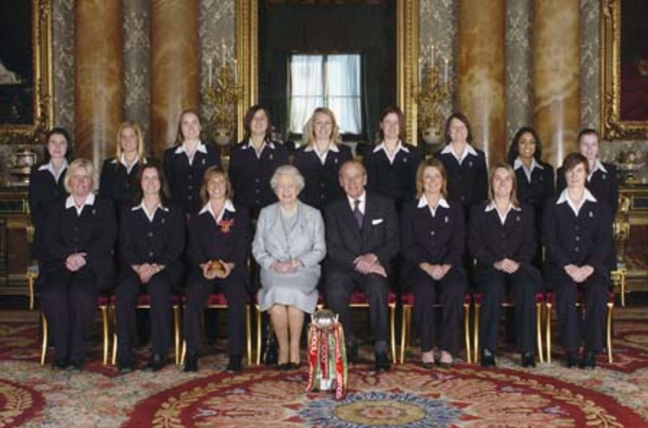 Queen Elizabeth II and the Duke of Edinburgh pose with members of England's women's 2005 Ashes winning Cricket team (Back row from left: Jo Watts, Katherine Brunt, Beth Morgan, Jenny Gunn, Rosalie Birch, Lydia Greenway, Arran Brindle, Isa Guha and Holly Colvin.  Front row from left:Charlotte Dickenson, Laura Newton, captain Clare Connor, vice-captain Charlotte Edwards, Jane Smit and Clare Taylor at Buckingham Palace on February 9, 2006 in London.