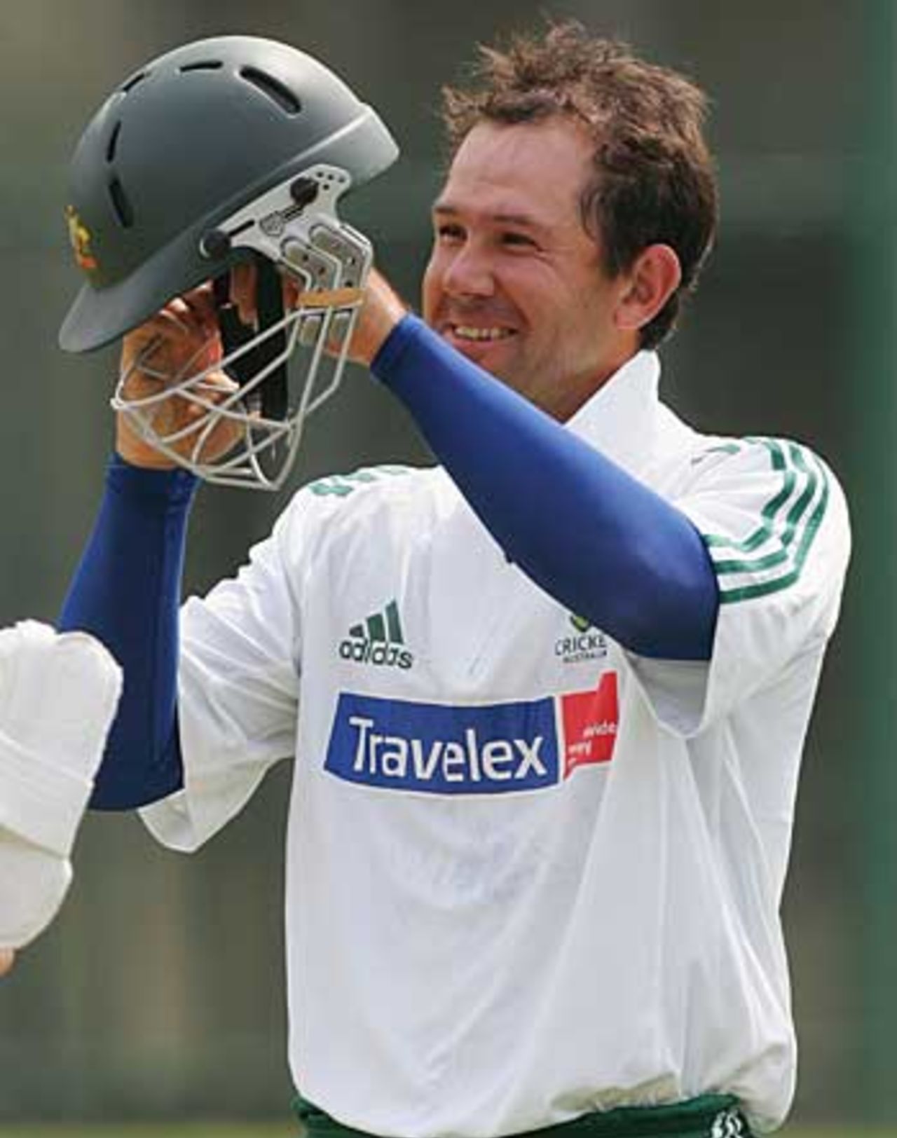 Ricky Ponting, all smiles, dons his helmet during a net session, Johannesburg, February 22, 2006