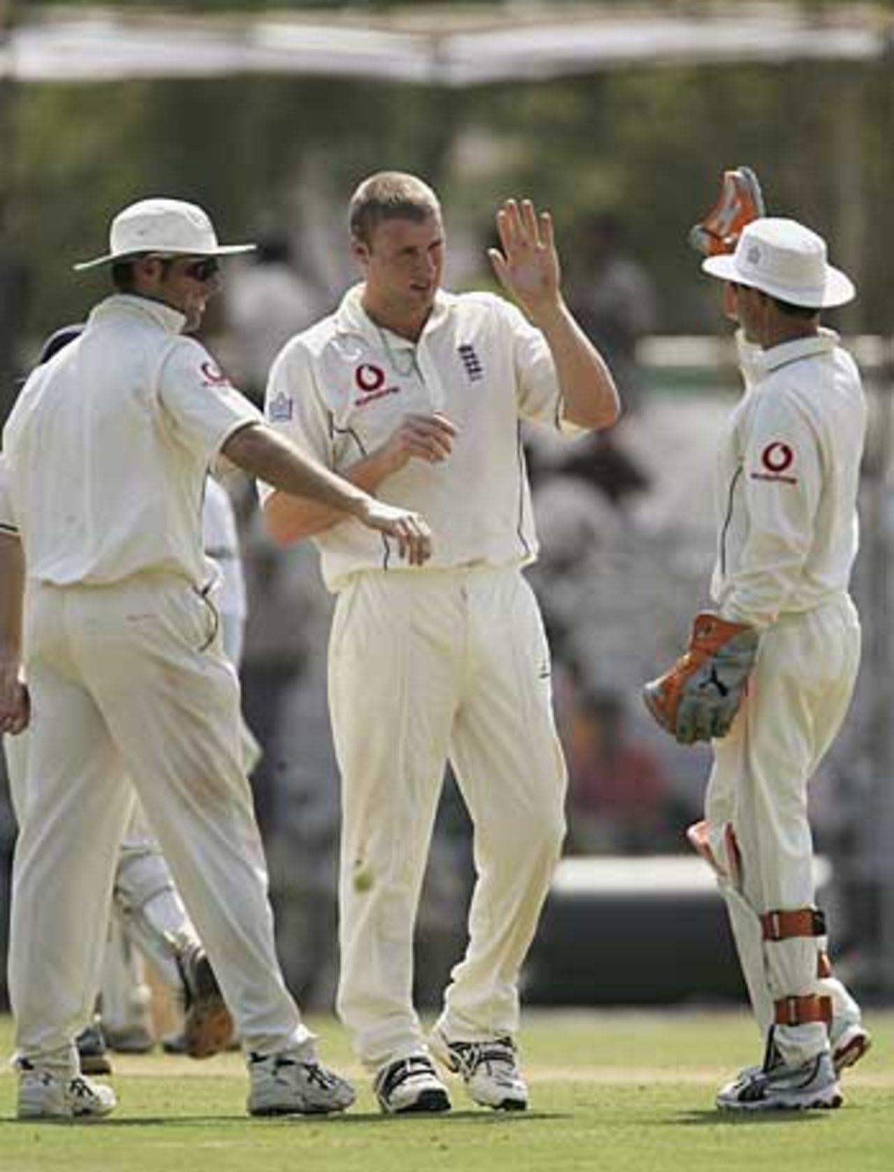 Andrew Flintoff is congratulated by Geraint Jones and Marcus Trescothick on grabbing a wicket, Indian Board President's XI v England XI, Tour game, Vadodara, 2nd day, February 24, 2006