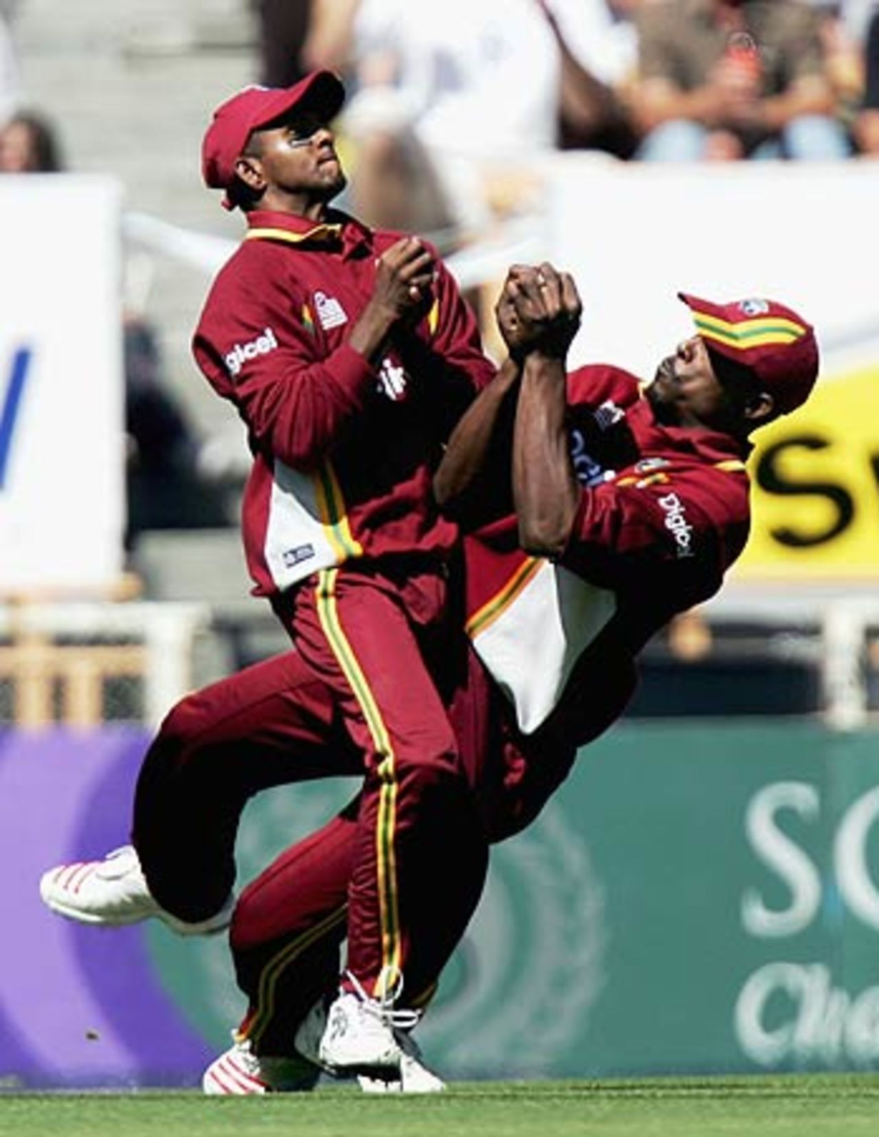 Runako Morton grabs on to the catch avoiding a collision with Shivnarine Chanderpaul, New Zealand v West Indies, 3rd ODI, Christchurch, February 25 2006
