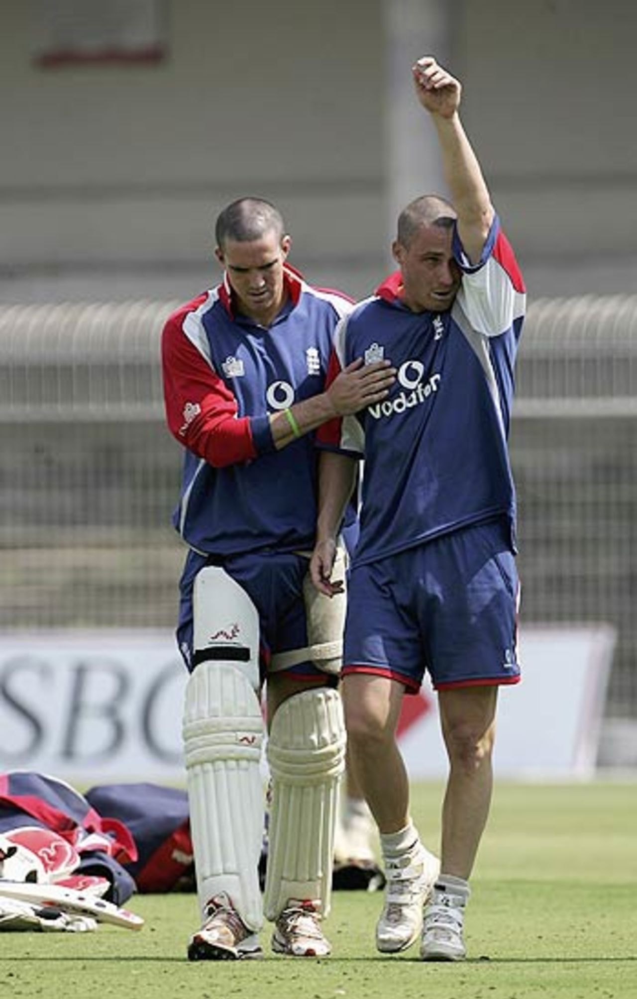 Simon Jones is consoled by Kevin Pietersen after twisting his left knee in the nets, Nagpur, February 27, 2006
