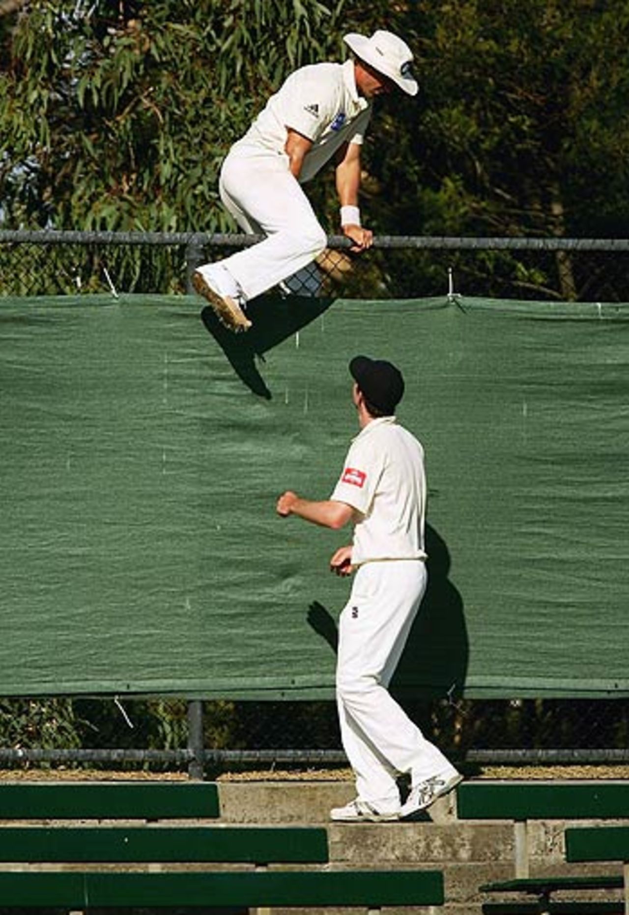 'Can I have the ball back please?' - Gerard Denton of the Bushrangers jumps the fence to retrieve the ball, Victoria v Queensland, Pura Cup, Melbourne, March 2 2006