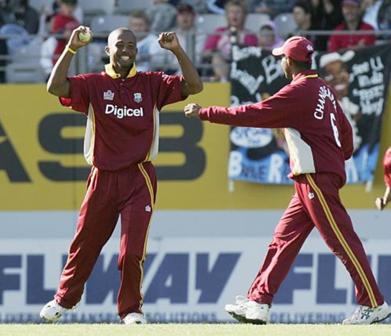 Dwayne Smith and Shivnarine Chanderpaul celebrate the dismissal of Scott Styris, New Zealand v West Indies, 5th ODI, Auckland, March 4, 2006 