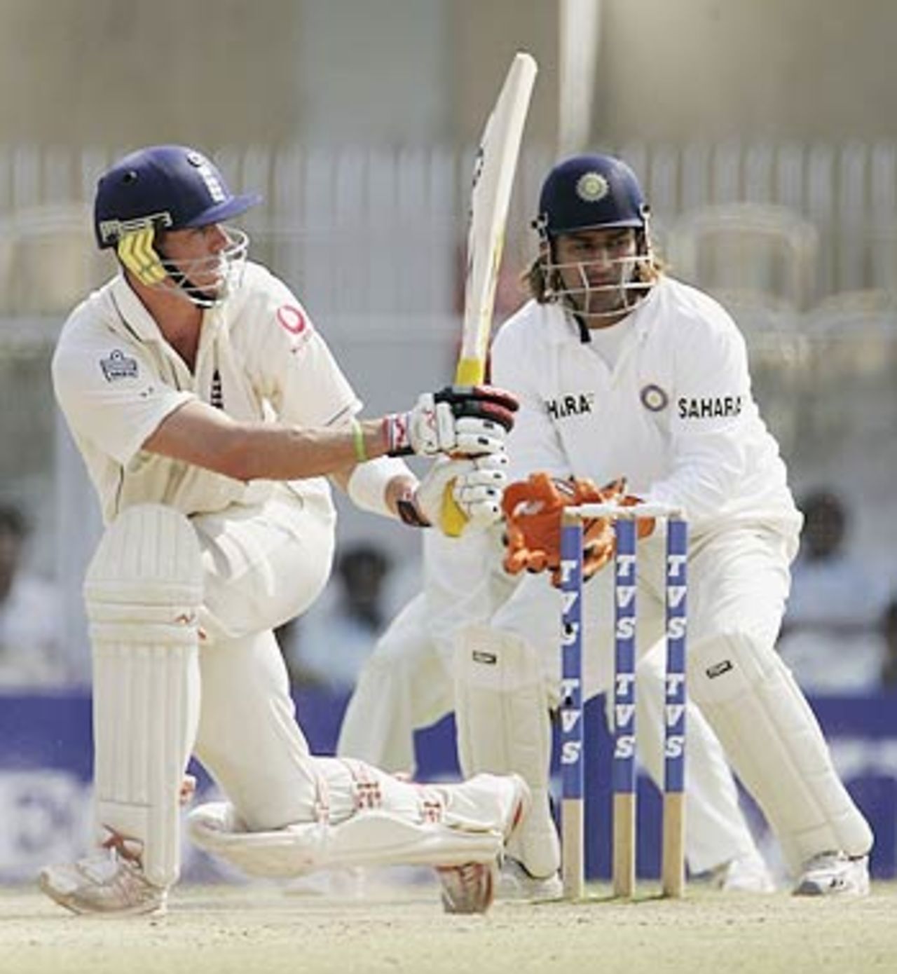 Mahendra Singh Dhoni looks on as Kevin Pietersen sweeps , India v England, Nagpur, March 4, 2006