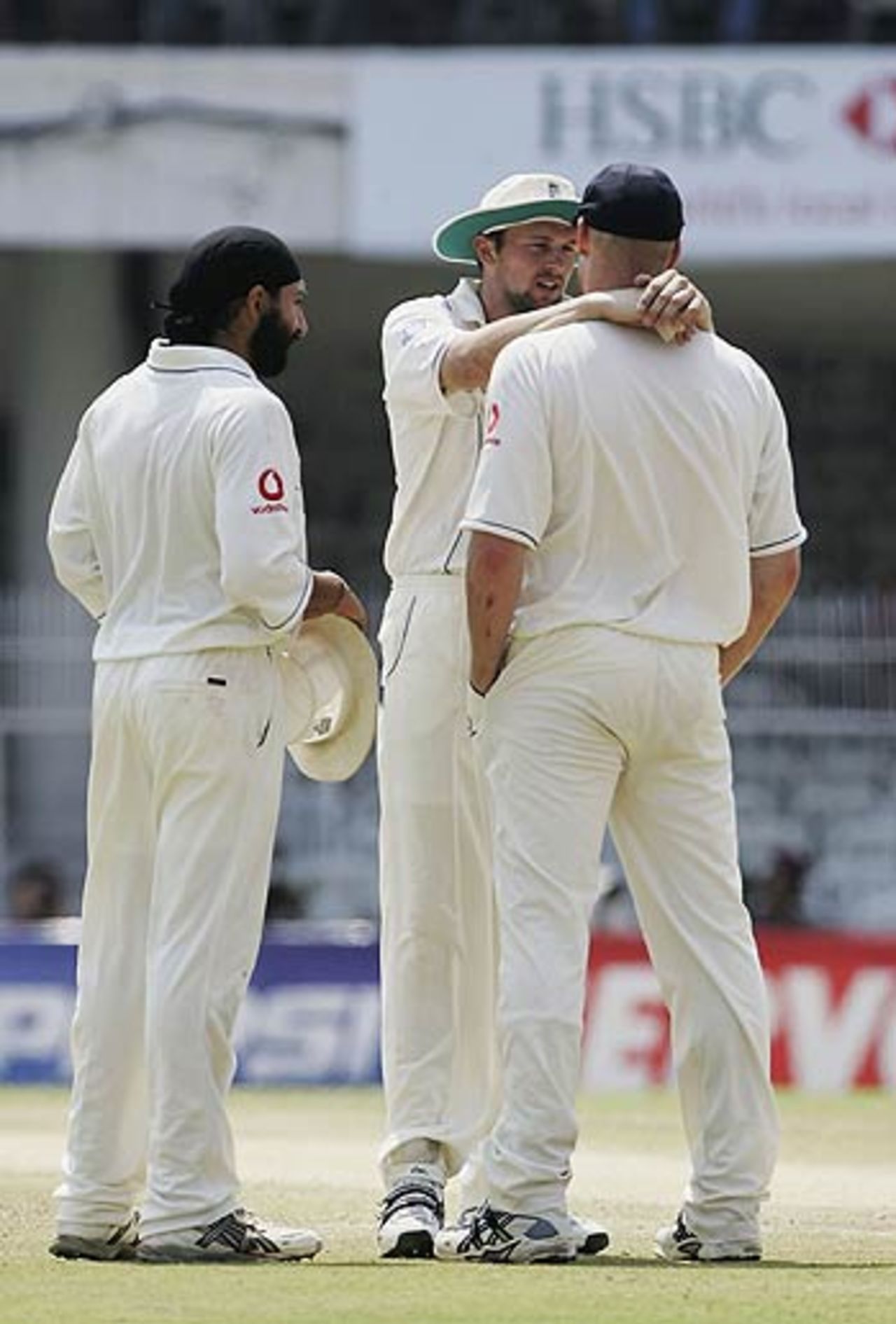 Steve Harmison has a chat with Andrew Flintoff as Monty Panesar looks on, India v England, 1st Test, Nagpur, March 5, 2006
