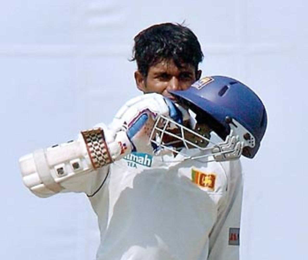 Upul Tharanga kisses his helmet after reaching his maiden ton, Bangladesh v Sri Lanka, 2nd Test, Bogra, 2nd day, March 9, 2006
