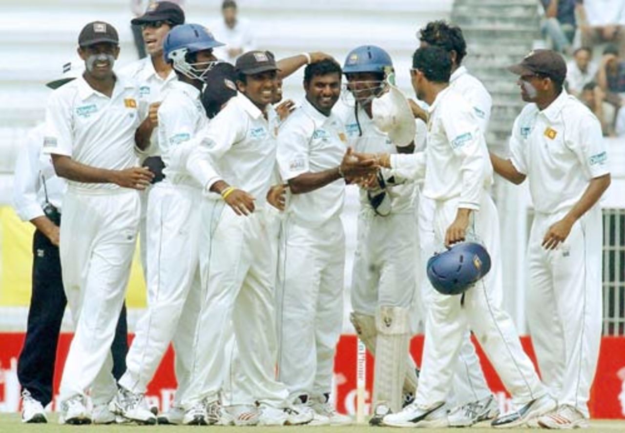 Muttiah Muralitharan is congratulated on taking his 600th Test wicket, Bangladesh v Sri Lanka, 2nd Test, Bogra, March 10, 2006 