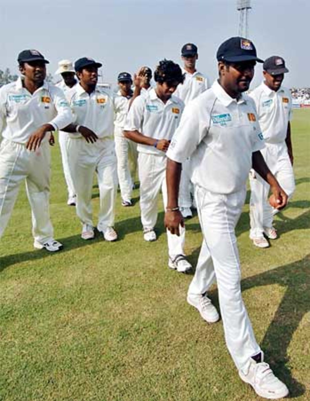 Muttiah Muralitharan leads Sri Lanka off on the day he reached 600 Test wickets, Bangladesh v Sri Lanka, 2nd Test, Bogra, 2nd day, March 9, 2006