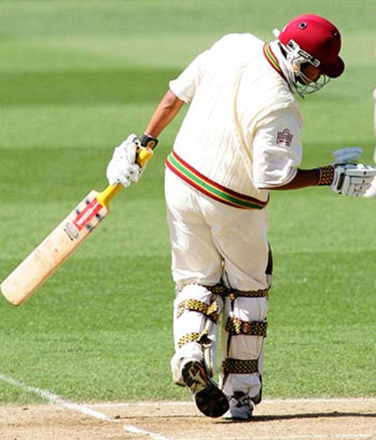 Ramnaresh Sarwan recoils after being hit in the head by a Shane Bond bouncer, New Zealand v West Indies, 1st Test, Auckland, 4th day, March 12, 2006