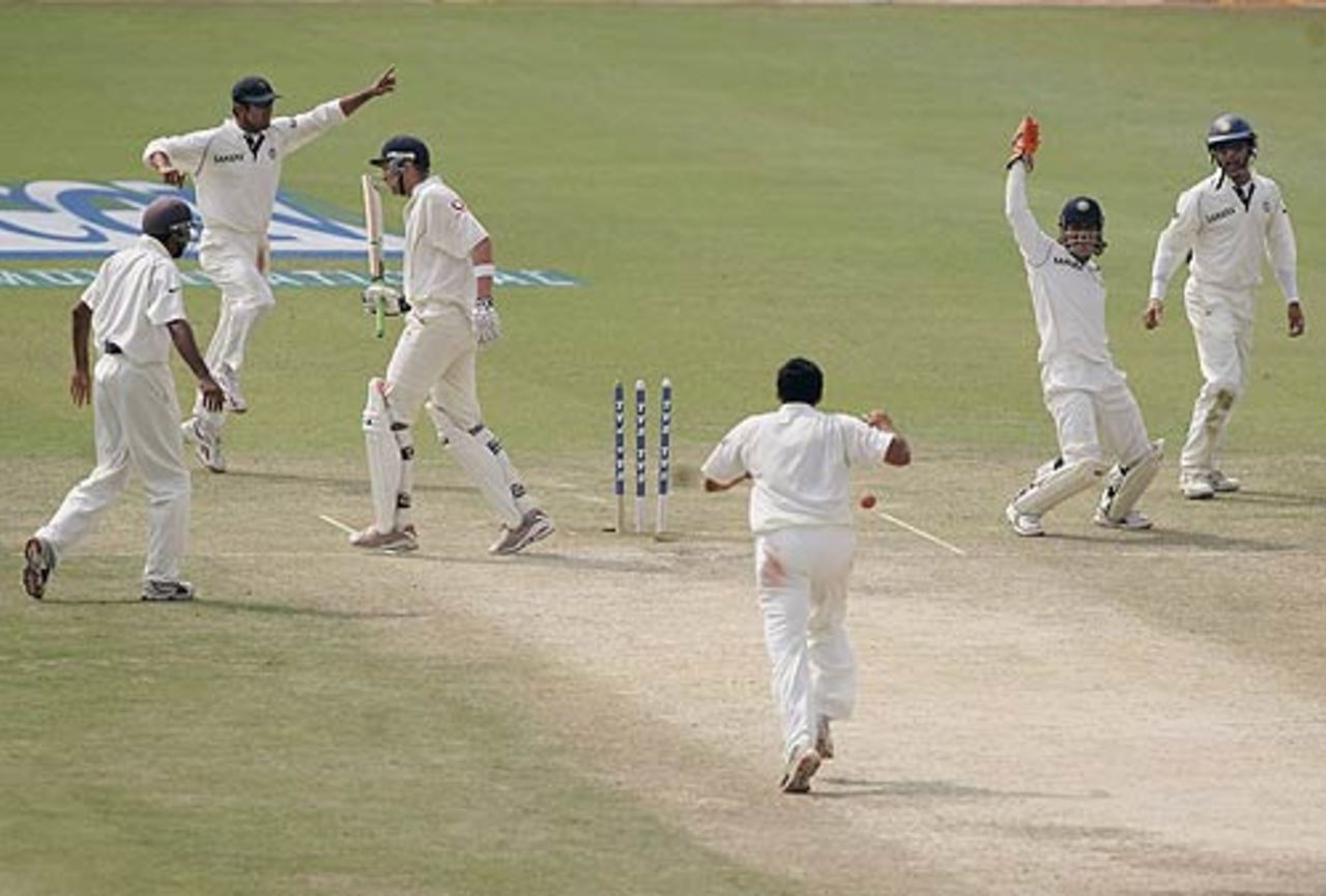 Mahendra Singh Dhoni effects a good stumping on the leg side to dismiss Steve Harmison, India v England, 2nd Test, Mohali, 5th day, March 13 2006