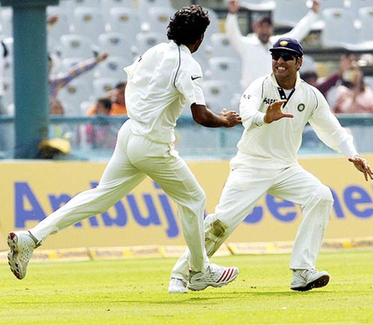 Munaf Patel and Yuvraj Singh celebrate a wicket, India v England, 2nd Test, Mohali, March 12, 2006
