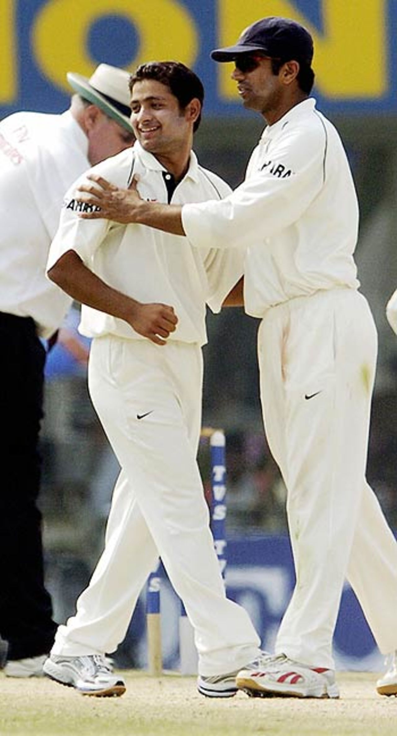 Rahul Dravid congratulates Piyush Chawla after his first Test wicket, India v England, 2nd Test, Mohali, March 12, 2006