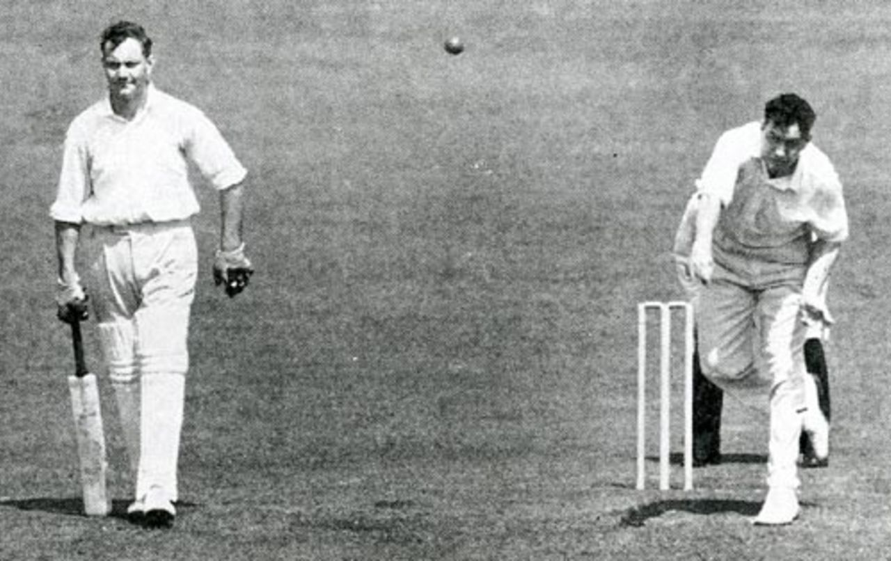 Alec Bedser bowls while brother Eric bats during the Test Trial in 1950