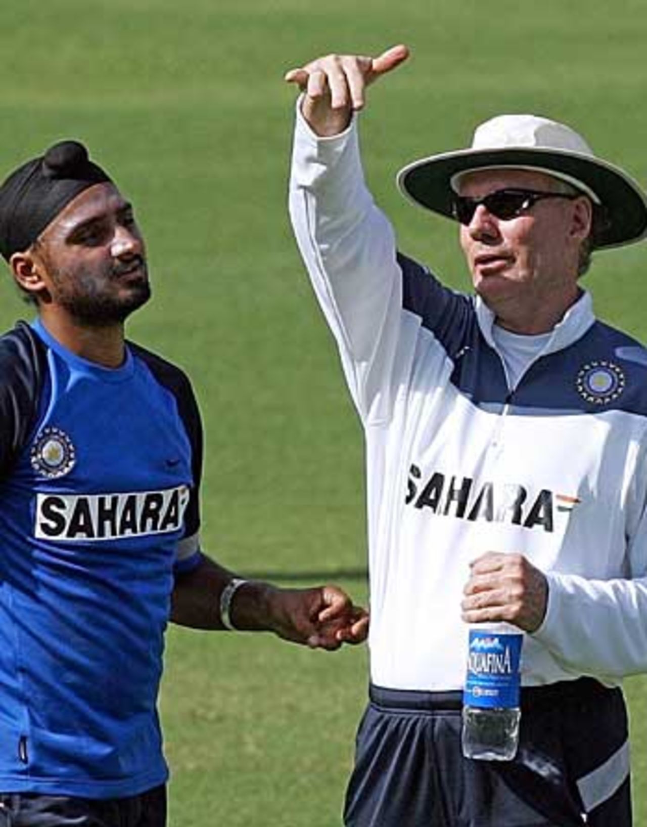 Harbhajan Singh receives some advice from his coach Greg Chappell ahead of the third Test against England, Mumbai, March 16, 2005