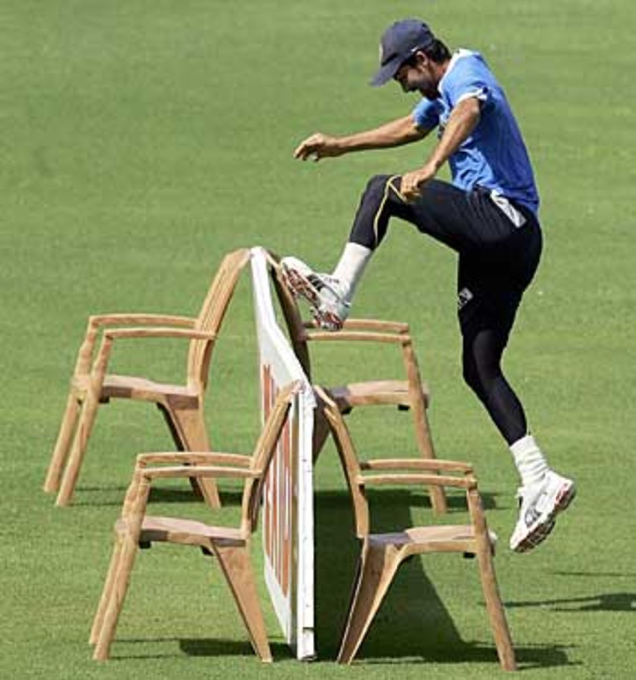 Mohammad Kaif leaps over a billboard during a training session ahead of the third Test against England, Mumbai, March 16, 2006