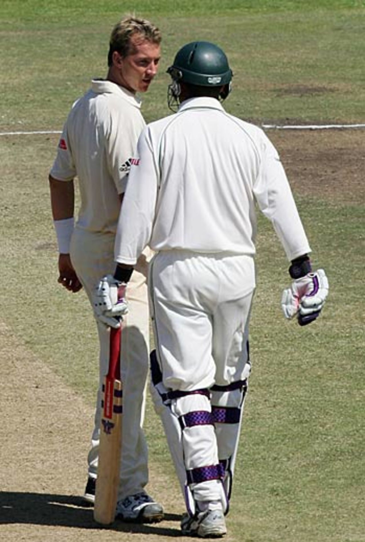 How are you? Brett Lee and Andrew Hall have words as South Africa are bowled out for 197, South Africa v Australia, 1st Test, Cape Town, March 18, 2006