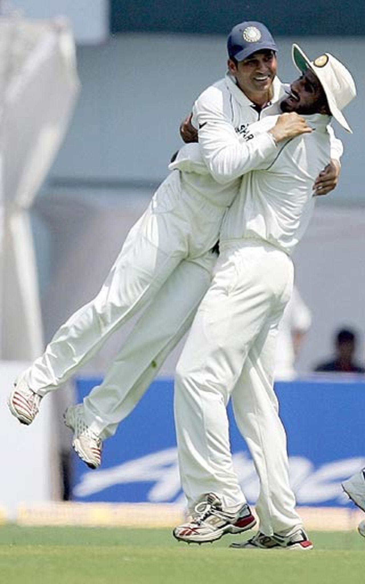 An elated Sachin Tendulkar celebrates a wicket with Harbhajan Singh, India v England, 3rd Test, Mumbai, 2nd day, March 19 2006