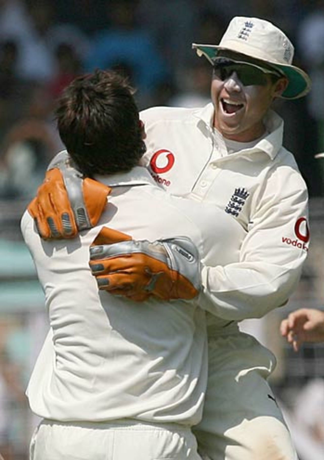 James Anderson hugs Geraint Jones who took an excellent diving catch to dismiss Harbhajan Singh, India v England, 3rd Test, Mumbai, 3rd day, March 20, 2006