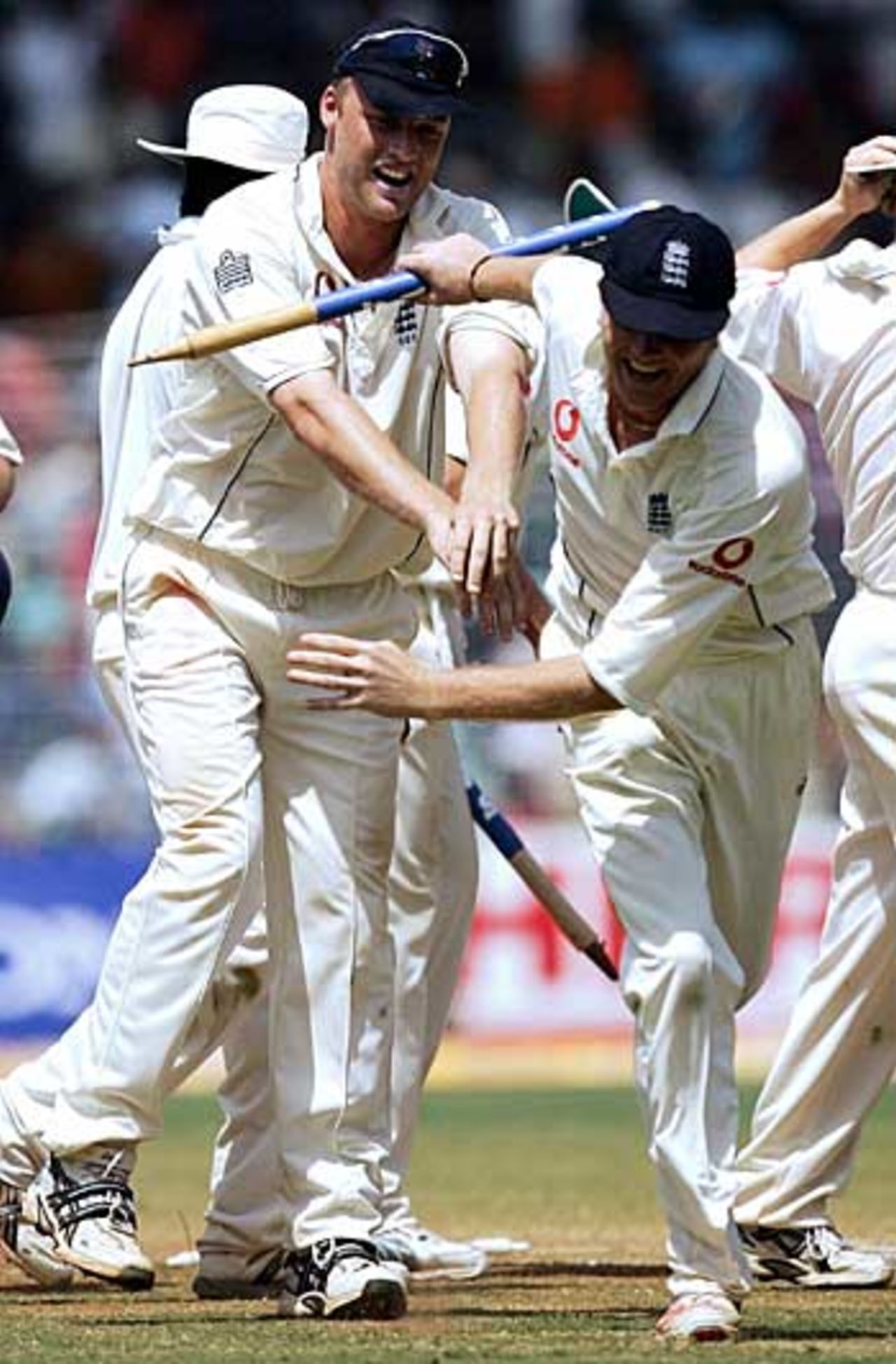 Oi! That's mine! Andrew Flintoff tries to grab a stump from Shaun Udal, India v England, 3rd Test, Mumbai, March 22, 2006