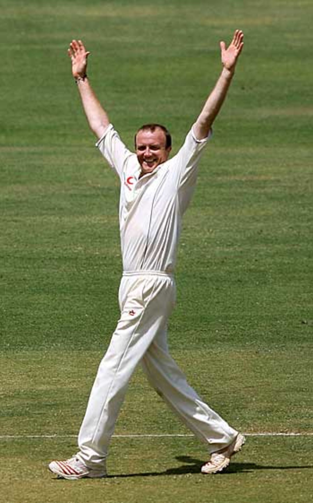 Not bad for a 37-year-old...Shaun Udal throws his arms up in delight after taking another wicket. He finished with 4 for 14, India v England, 3rd Test, Mumbai, March 22, 2006